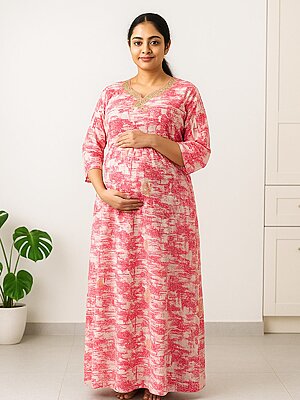 Pregnant South Indian woman wearing a cotton maternity nursing nighty with three-fourth sleeves and frill detailing, designed for comfort and easy nursing access.
