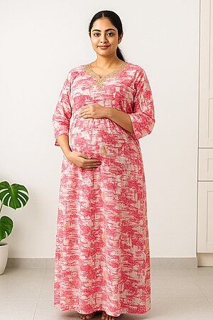 Pregnant South Indian woman wearing a cotton maternity nursing nighty with three-fourth sleeves and frill detailing, designed for comfort and easy nursing access.