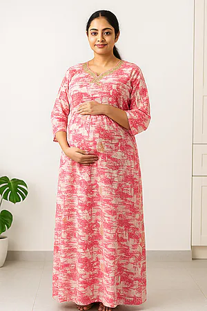 Pregnant South Indian woman wearing a cotton maternity nursing nighty with three-fourth sleeves and frill detailing, designed for comfort and easy nursing access.