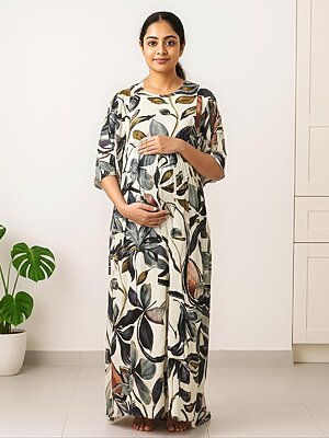 Woman wearing a rayon maternity maxi dress with both side zippers for feeding